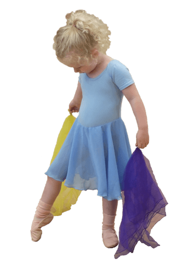 A young child in a light blue ballet dress, holding yellow and purple scarves, looking down with one foot pointed.