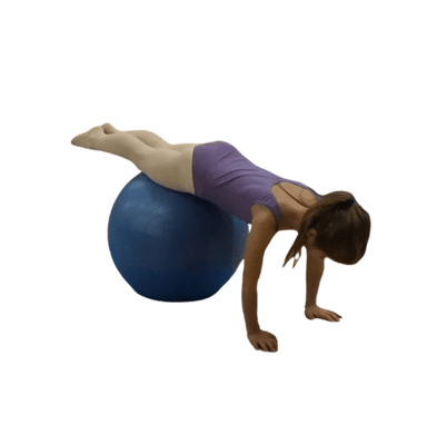 A child balancing on a large blue exercise ball, lying face down with legs extended straight behind.